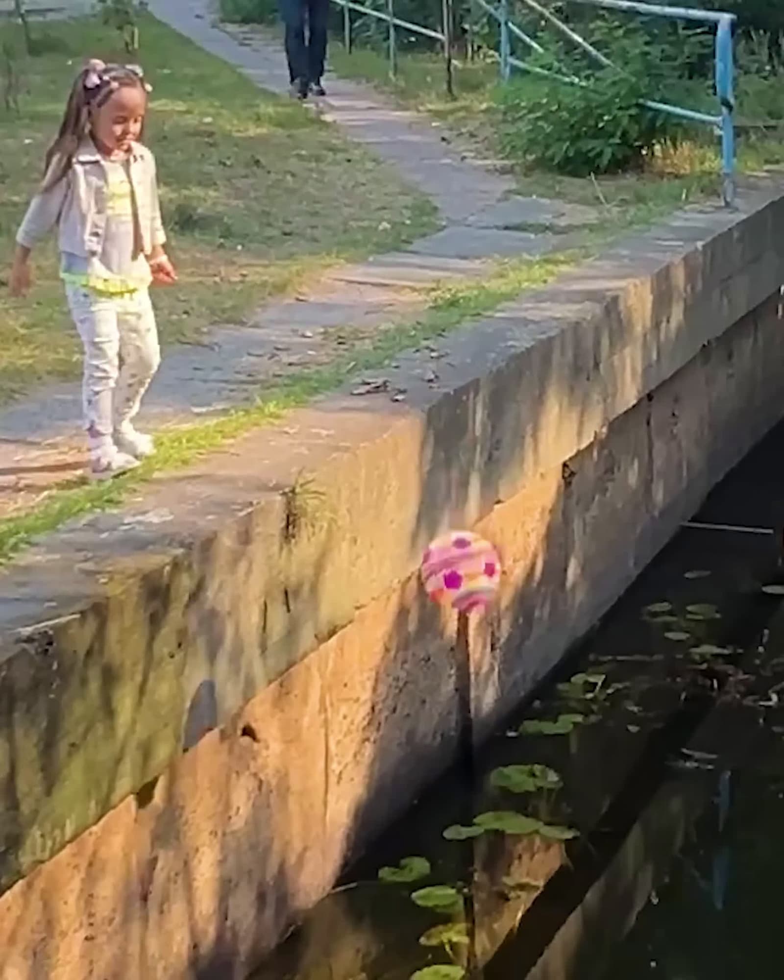 cover for Excavator operator helps girl whose ball fell into water