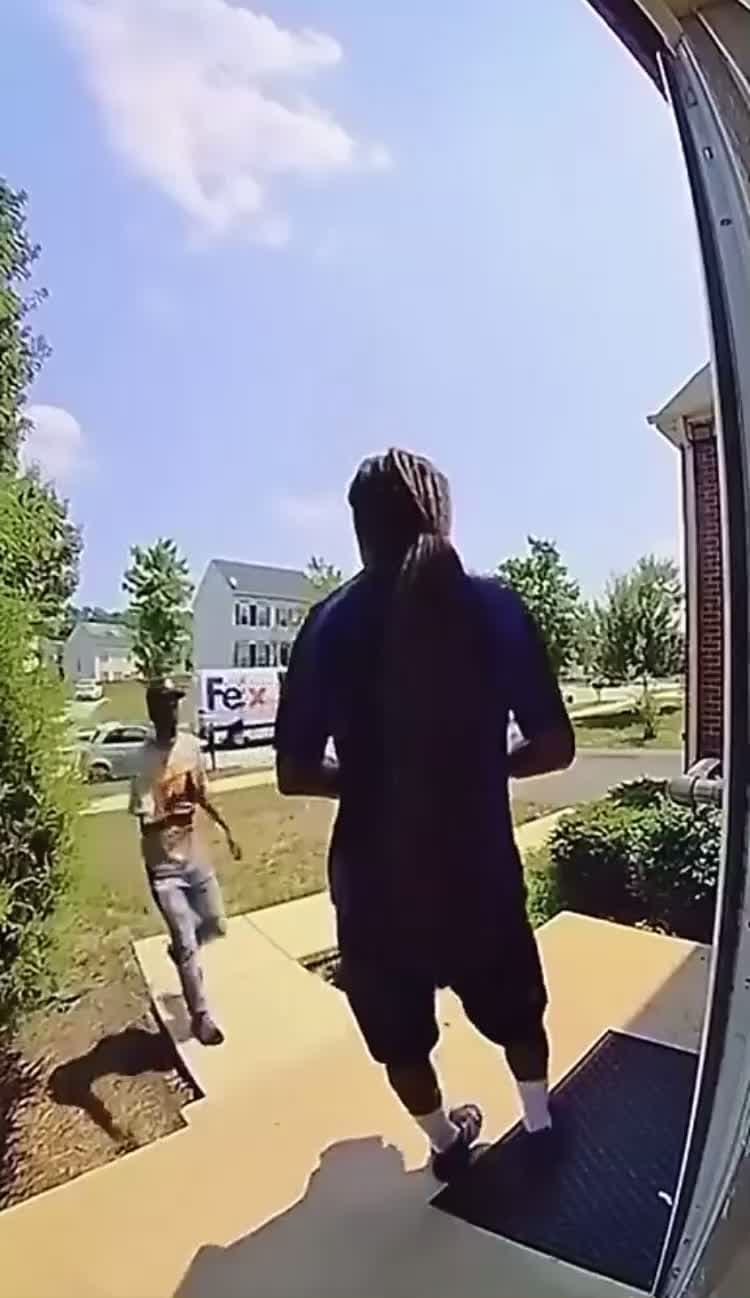 cover for FedEx worker wards off porch pirates while delivering package