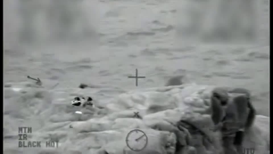 cover for Video shows Coast Guard rescue 4 kids stranded on rock in Lake Superior