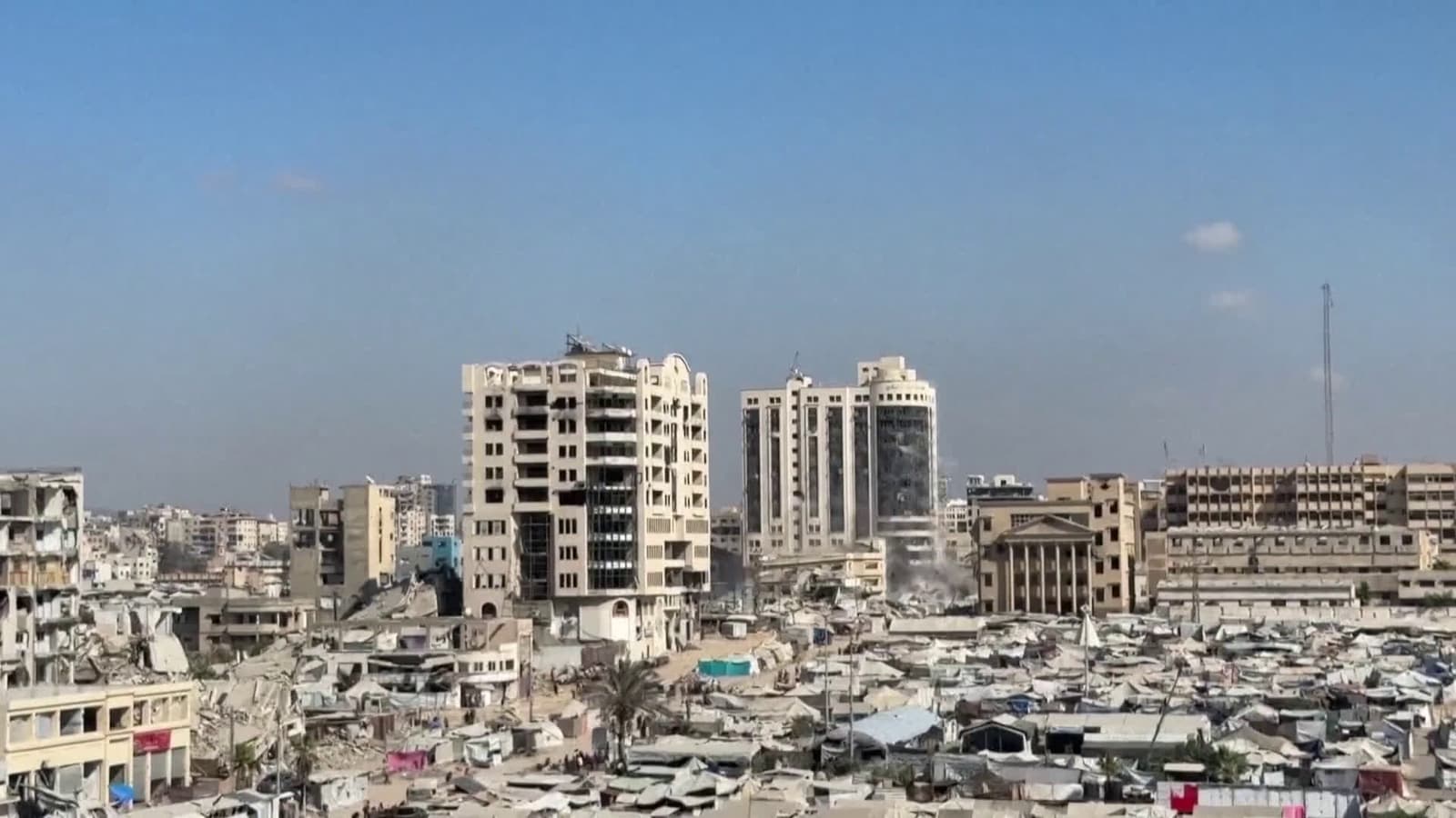 cover for Israel destroys high-rise buildings in Gaza City amid ramped-up offensive