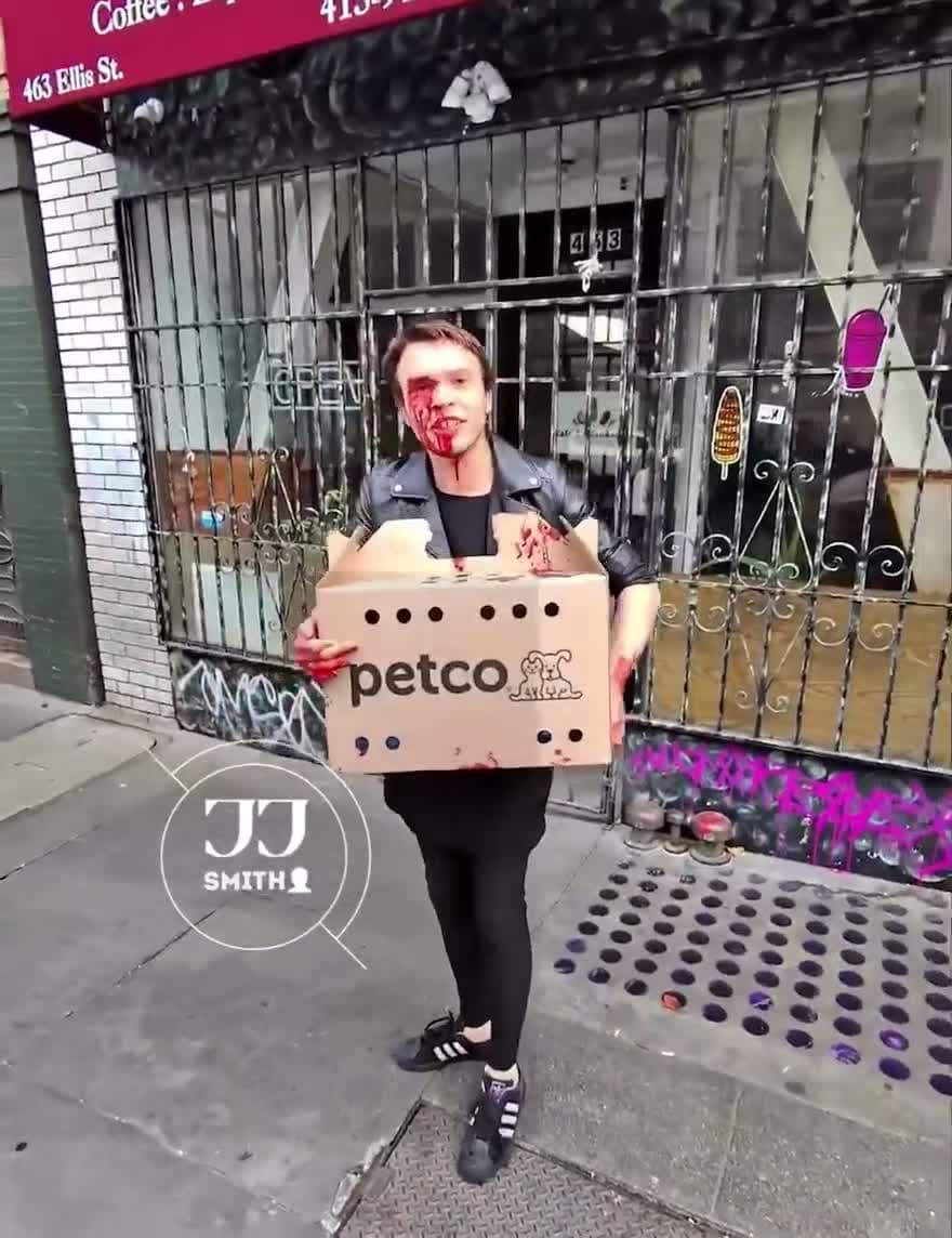 cover for Another bizarre scene in San Francisco’s Tenderloin neighborhood. Dude wearing a dress claims his cat bloodied his face. Instead if wiping it off, he walks around in public.