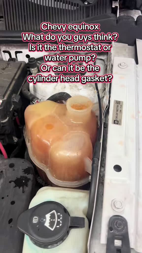 cover for Chevy Equinox overheating! Is it the thermostat, water pump, or head gasket? Drop your thoughts! 🚗🔧 #CarRepair #ChevyEquinox #MechanicLife