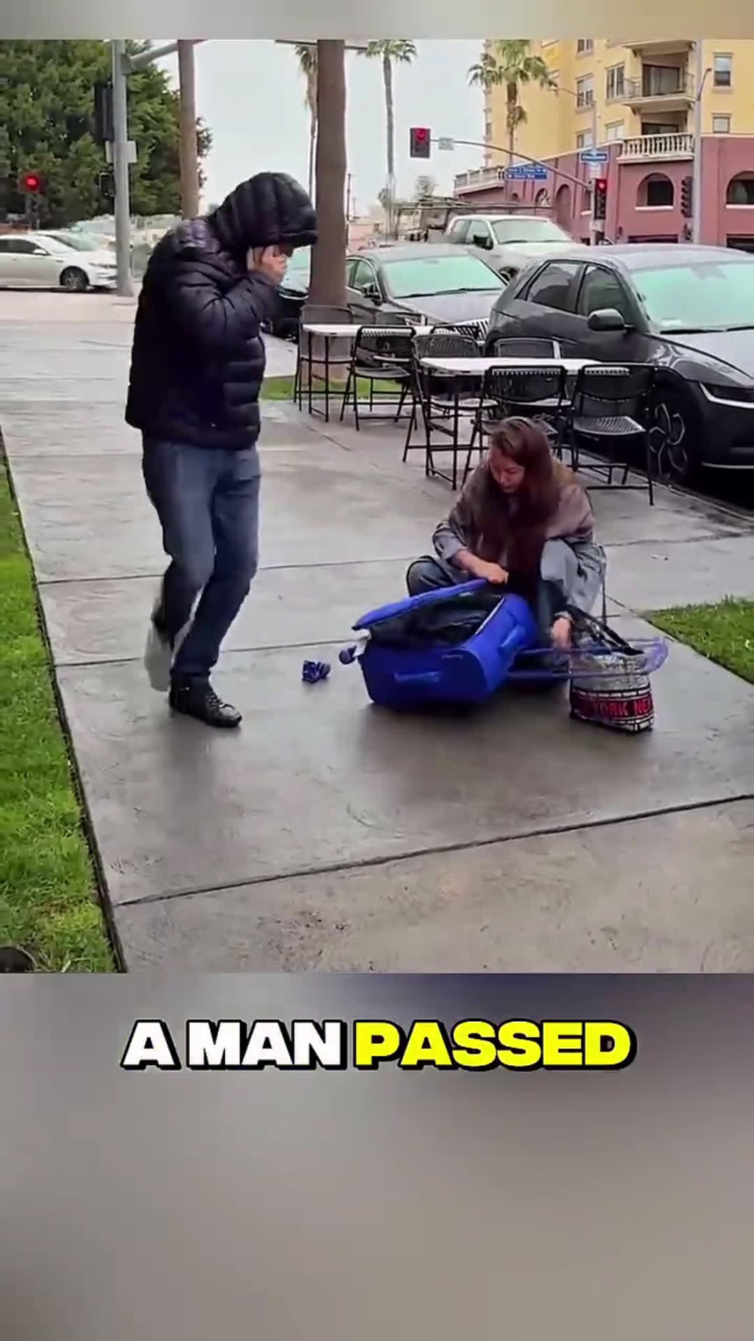 cover for Stranger Rushes to Help Woman in Rain While Everyone Else Walks By #kindness #wholesome