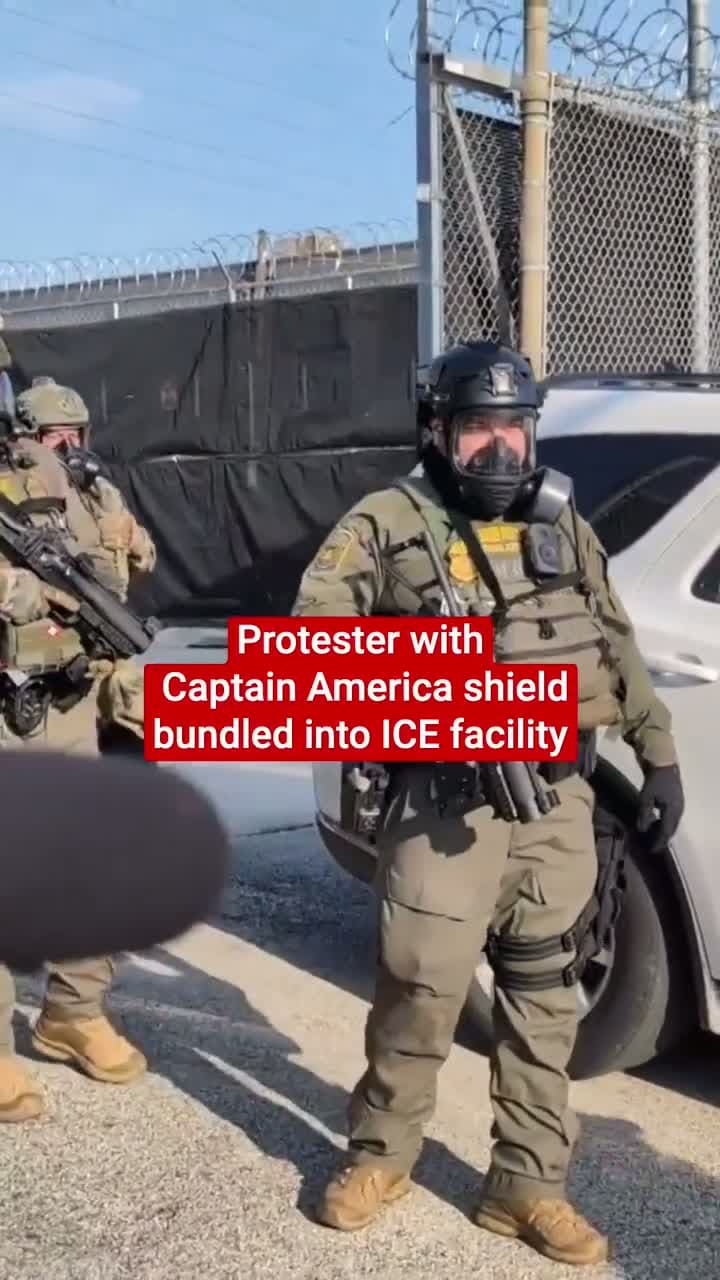 cover for This is the moment that an ICE protester wielding a Captain America shield was forced into an immigration facility after he threw a tear gas canister at enforcement agents.Footage shared on Friday (19 September) shows the indi...