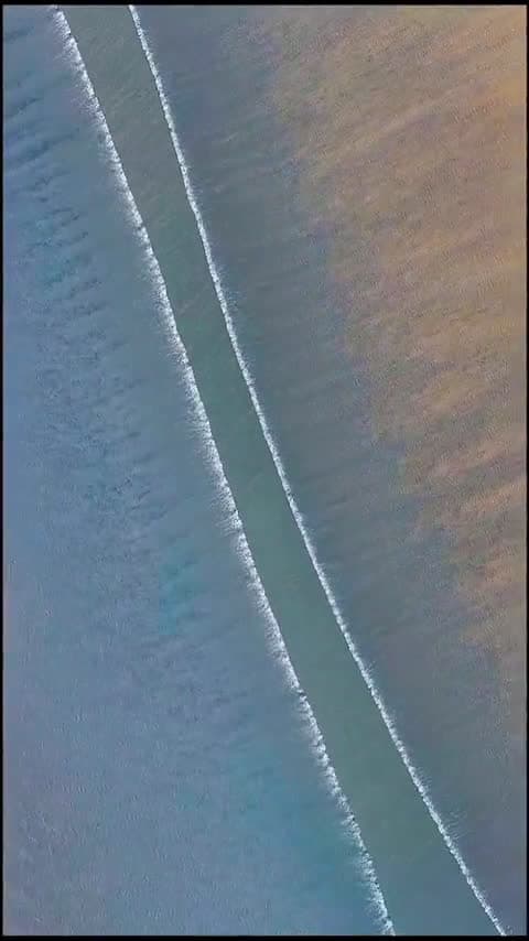cover for Two ocean waves collide in a mesmerizing aerial dance 🌊 #OceanWaves #WaveCollision #NatureLovers #AerialView
